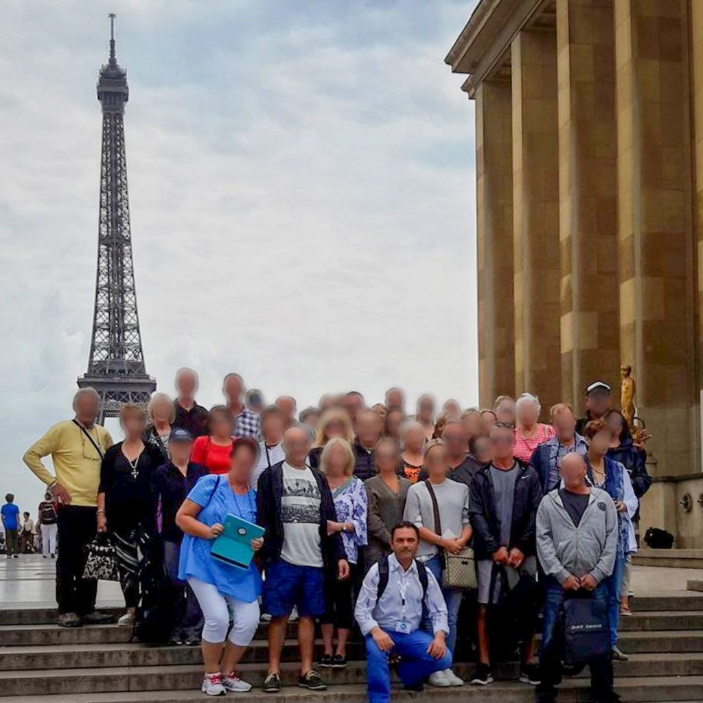 Travelway group in Paris with Eiffel tower in the background